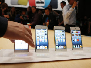 Members of the media experience the iPod Touch after its introduction during Apple Inc.'s iPhone media event in San Francisco